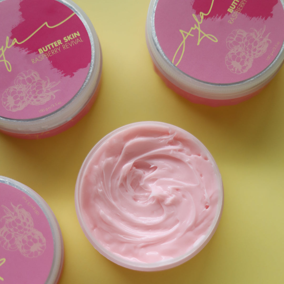 Pink cream in a jar with a visible brand logo on a yellow background